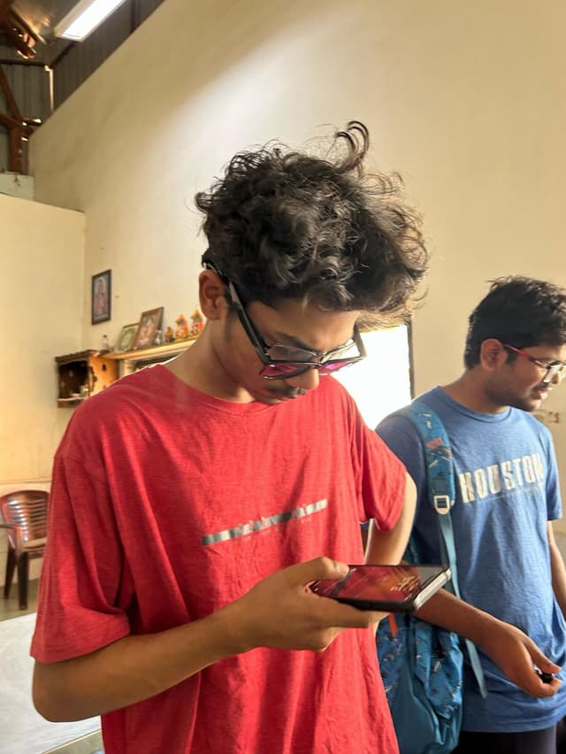 Sai in red shirt